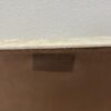 Vintage Hocker mit hellem Stoffbezug und Rollen
