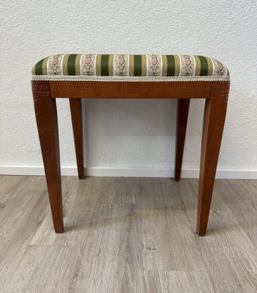 Vintage Polsterhocker mit grün geblümtem Stoffbezug