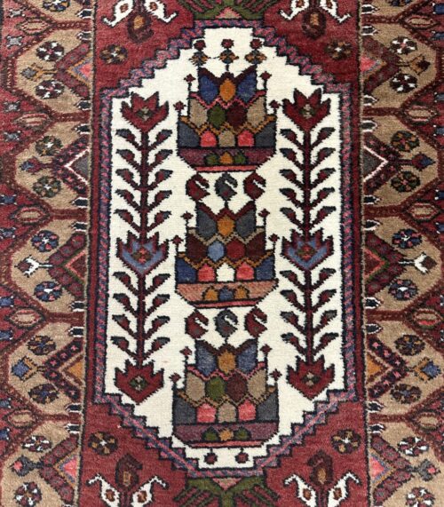 Vintage Orientteppich aus Wolle mit buntem Blumenmuster