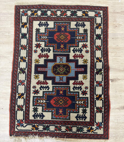 Vintage Orientteppich mit geometrischem Muster und Fransen