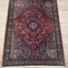 Vintage Orientteppich rot mit floralen Mustern aus Wolle