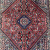 Vintage Orientteppich rot mit floralen Mustern aus Wolle