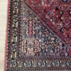 Vintage Orientteppich rot mit floralen Mustern aus Wolle