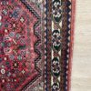 Vintage Orientteppich rot mit floralen Mustern aus Wolle