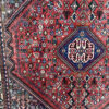Vintage Orientteppich rot mit floralen Mustern aus Wolle