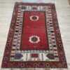 Vintage Orientteppich in Rot mit floralem Muster aus Wolle
