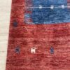 Vintage Wollteppich mit Figurenmotiv in Rot und Blau
