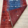 Vintage Wollteppich mit Figurenmotiv in Rot und Blau
