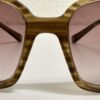 Vintage Sonnenbrille mit rosa Farbverlauf und Transparentrahmen