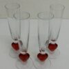 Sektgläser mit rotem Herz im Fuss aus Glas