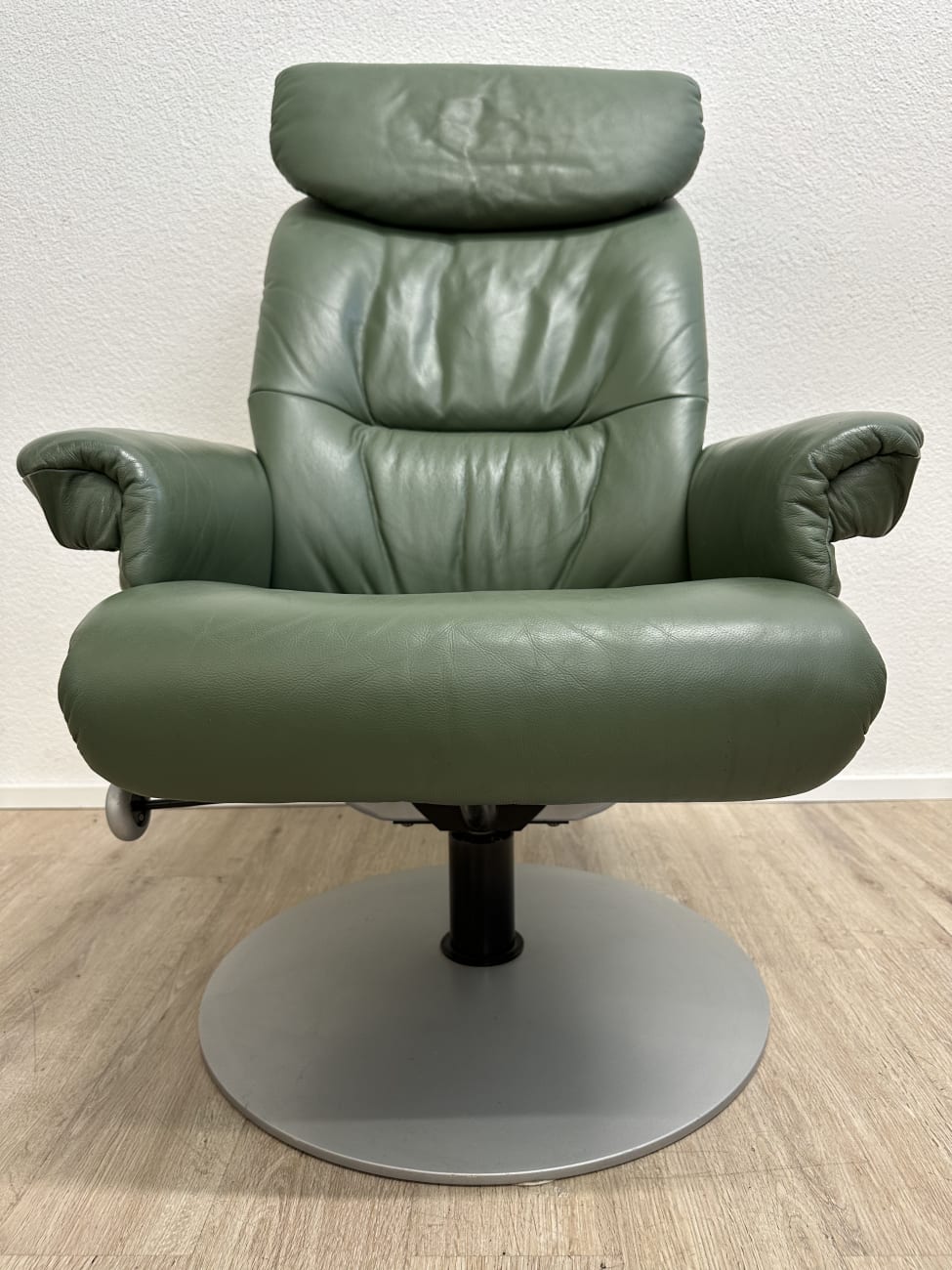 Vintage Drehsessel mit Ottoman in Dunkelgrün